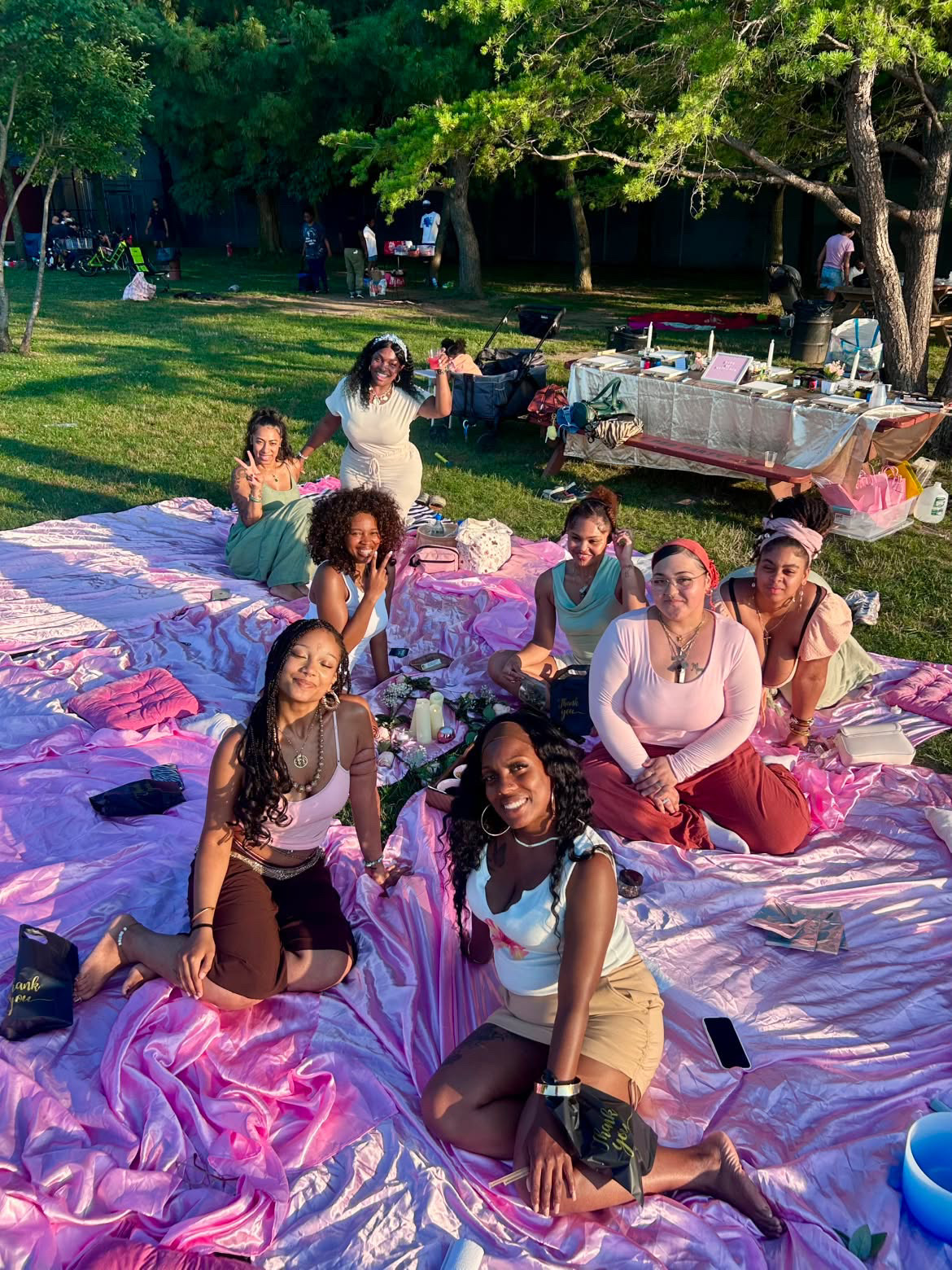 The sisterhood gathered on the picnic blankets